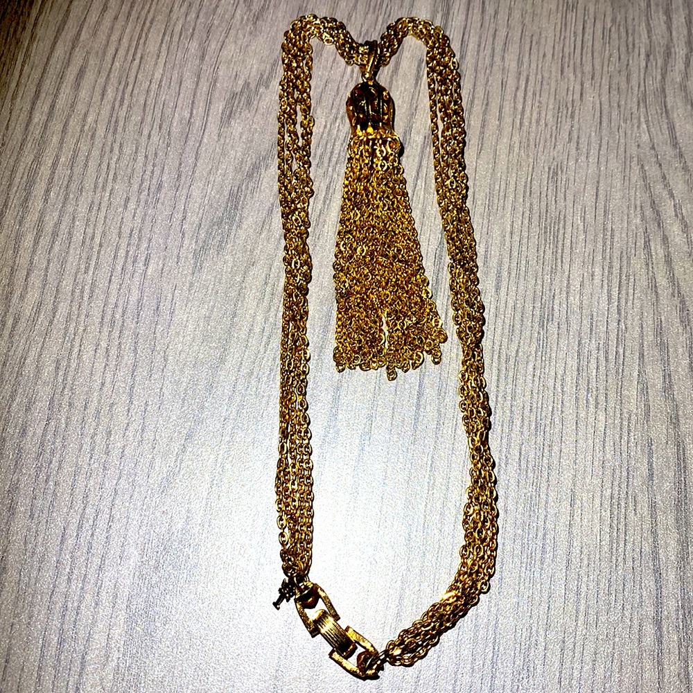 Signed Trifari Golden multi -chain necklace with a bell-like tassel